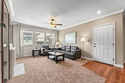 a living room with a couch and a table at New Luxurious 1BR Apartment Heated Pool Spa & Sauna in Reno