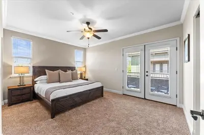 a bedroom with a bed and a ceiling fan at New Luxurious 1BR Apartment Heated Pool Spa & Sauna in Reno