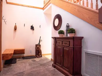 a cat sitting in a hallway with a stair case at Mountain Retreat near Skiing, HotTub, PetFriendly in Tahoe City