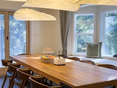 a dining room with a wooden table and chairs at Mountain Retreat near Skiing, HotTub, PetFriendly in Tahoe City
