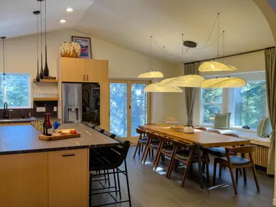 a kitchen with a large wooden table and chairs at Mountain Retreat near Skiing, HotTub, PetFriendly in Tahoe City