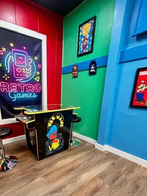 a childs room with a toy table and a game room at GameZone in Sparks
