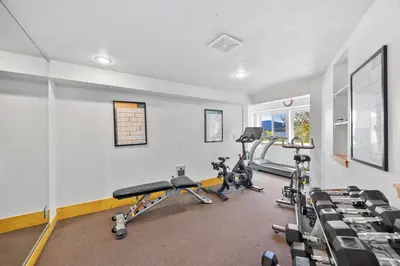 a gym with two treadmills and two exercise bikes at Remodeled 4BR Lakefront with Exceptional Amenities in Kings Beach
