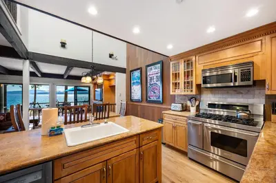 a kitchen with a sink and a stove top oven at Remodeled 4BR Lakefront with Exceptional Amenities in Kings Beach
