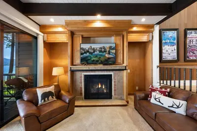 a living room with two couches and a fireplace at Remodeled 4BR Lakefront with Exceptional Amenities in Kings Beach