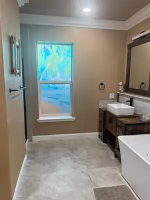 a bathroom with a sink and a window at Beach House Staycation in Sparks