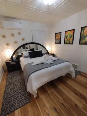 a bedroom with a large bed in a room at MidTown Art Deco in Reno