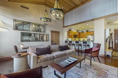 a living room with a couch and a table at Northstar Escape + Northstar Getaway in Truckee