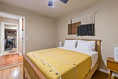 a bedroom with a large bed in a room at Huge House-Yard-Pool Hot Tub in Citrus Heights