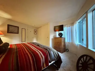 a bedroom with a bed and a window at One The First Fairway - Walk to the Lake in Incline Village