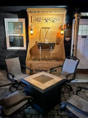 a wooden table with two chairs and a music machine at Romantic Couples Retreat - Tahoe Room in Reno