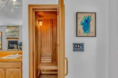 a door leading to a kitchen with a sink at Luxury Truckee Retreat with Hot Tub and Sauna in Truckee