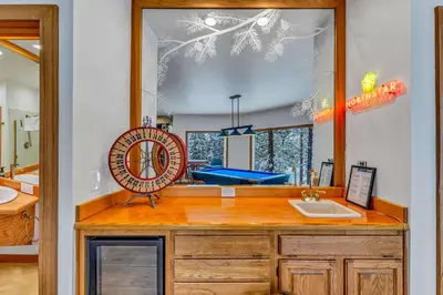 a bathroom with a sink and a mirror at Luxury Truckee Retreat with Hot Tub and Sauna in Truckee