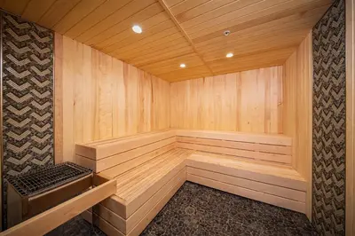 a large wooden sauna with a bench in it at Palisades Tahoe Lodge Rentals Premium Studio Loft #358 in Olympic Valley