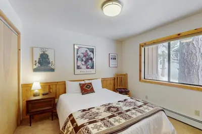 a bedroom with a bed and a window at North Shore Escape in Carnelian Bay