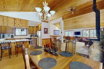 a dining room and kitchen with a table and chairs at North Shore Escape in Carnelian Bay