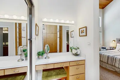 a bathroom with a sink and a mirror at Northstar Paradise in Ponderosa Fairway Estates