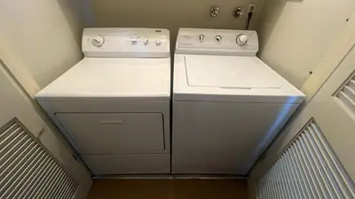 a small kitchen with two white appliances in a room at LLC1236 - Lakeside Landing condo in South Lake Tahoe