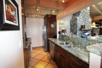 a kitchen with a sink and a refrigerator at LLC1236 - Lakeside Landing condo in South Lake Tahoe