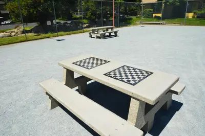 a picnic table and two benches in a park at Bearadise At North Shore Winter Special in Bass Lake