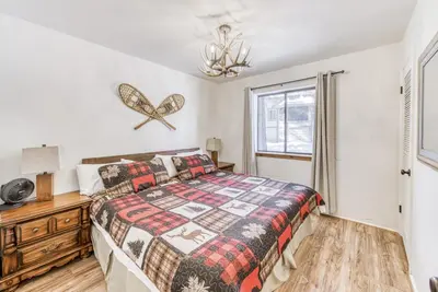a bedroom with a bed and a window at Blue Basecamp - Adventure Starts HERE! in Shaver Lake