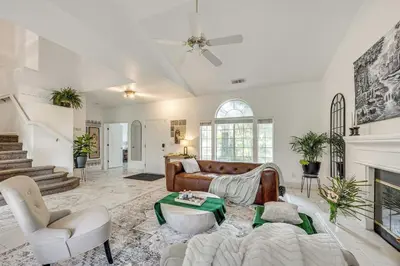 a living room with a couch and a fireplace at Rudraksha-Luxurious 5 BR House, Prime Location, Shopping, Dining, Medical, Education, Tourist Attractions in Fresno