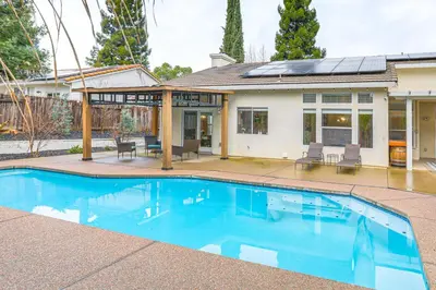 a swimming pool in front of a house at Family Home Near Folsom Lake in El Dorado Hills! in El Dorado Hills