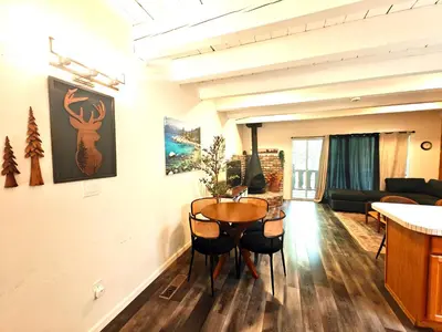 a living room with a table and a couch at 3BR Condo Near Lake & Skiing in Incline Village