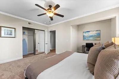 a bedroom with a bed and a ceiling fan at New Elegant 1BR Retreat Heated Pool Gym & Sauna in Reno