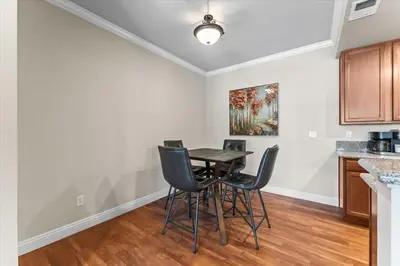 a dining room with a table and chairs at New Cozy & Stylish 1BR with Heated Pool Relaxing Spa & Sauna in Reno