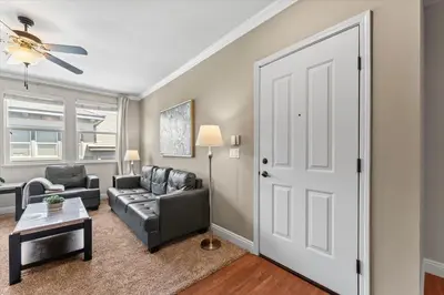 a living room with a couch and a door at New Cozy & Stylish 1BR with Heated Pool Relaxing Spa & Sauna in Reno