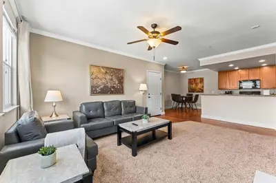 a living room with a couch and a table at New Upscale 1BR Stay with Mini Golf Sauna & Heated Pool in Reno