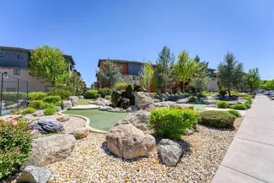 a garden with rocks and trees and a sidewalk at New Upscale 1BR Stay with Mini Golf Sauna & Heated Pool in Reno