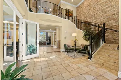 an open hallway with a staircase and a brick wall at New Upscale 1BR Stay with Mini Golf Sauna & Heated Pool in Reno