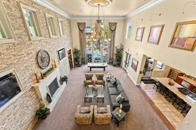 an aerial view of a living room with a large brick wall at New Upscale 1BR Stay with Mini Golf Sauna & Heated Pool in Reno