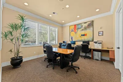 an office with a table and chairs and a plant at New Upscale 1BR Stay with Mini Golf Sauna & Heated Pool in Reno