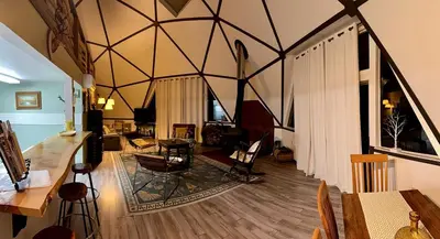 a large living room with a large ceiling at Unique and Secluded Dome Getaway near Sacramento, California in Pioneer