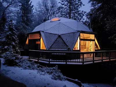 a dome house in the snow at night at Unique and Secluded Dome Getaway near Sacramento, California in Pioneer