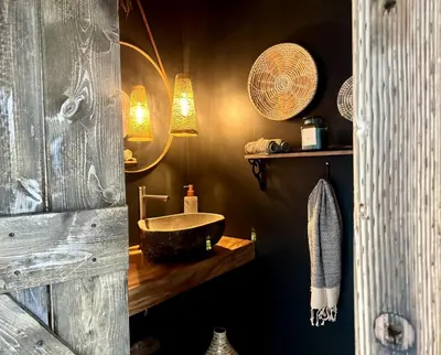 a bathroom with a sink and a wooden counter at Luxury Design Rental with Breathtaking Mountain Views in Lone Pine, California in Lone Pine