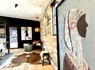 a room with a wall with a mural of a woman at Luxury Design Rental with Breathtaking Mountain Views in Lone Pine, California in Lone Pine