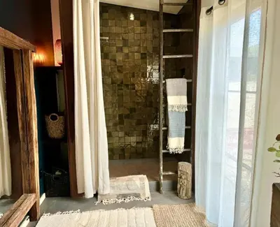 a bathroom with a shower with a shower curtain at Stunning Design Rental Incredible for a Luxury Escape in Lone Pine, California in Lone Pine