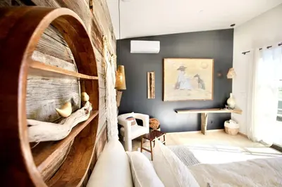 a living room with a large wooden wall at Stunning Design Rental Incredible for a Luxury Escape in Lone Pine, California in Lone Pine