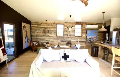 a bedroom with a bed with a cross on it at Stunning Design Rental Incredible for a Luxury Escape in Lone Pine, California in Lone Pine