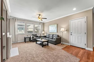 a living room with a couch and a table at New Cozy 1BR Apt with Gym Sauna & Heated Pool Access in Reno