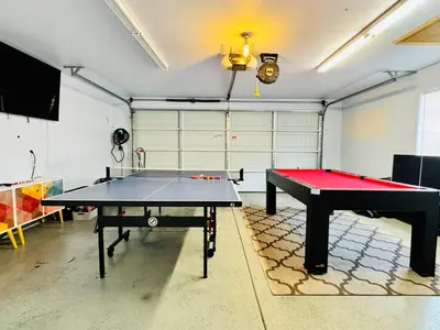 a room with two ping pong tables in it at Home at Yosemite Oakhurst in Oakhurst