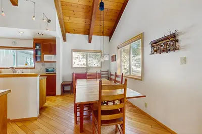 a kitchen and dining room with a table and chairs at Mountain View Getaway in Stateline