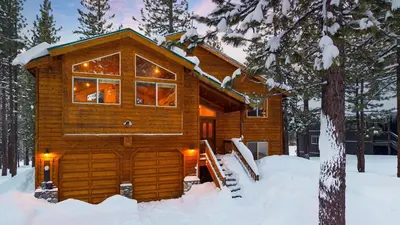 a log cabin in the snow with snow at Oslo Haus by AvantStay Cabin Retreat Near Northstar Downtown Truckee in Truckee
