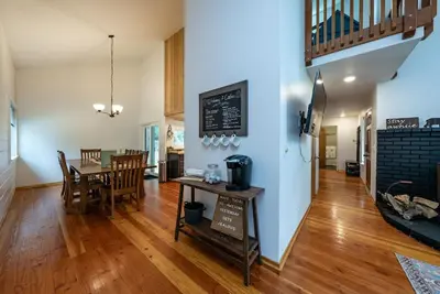 a dining room and living room with a table and chairs at My Side of the Mountain Rest Recharge Repeat in Shaver Lake