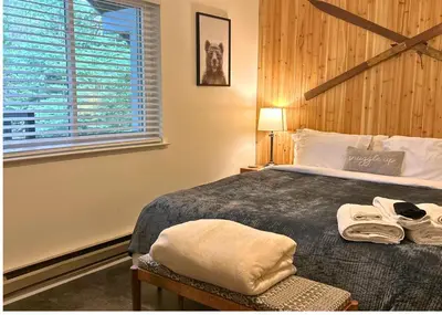 a bedroom with a bed and a window at My Side of the Mountain Rest Recharge Repeat in Shaver Lake