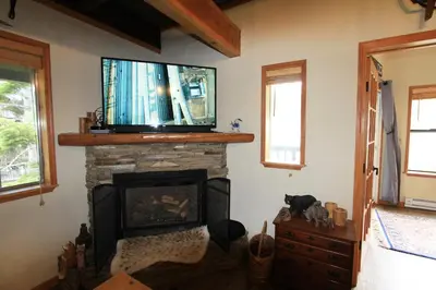 a living room with a fireplace with a flat screen tv above it at HNC0628 - Stagecoach Escape condo in Stateline